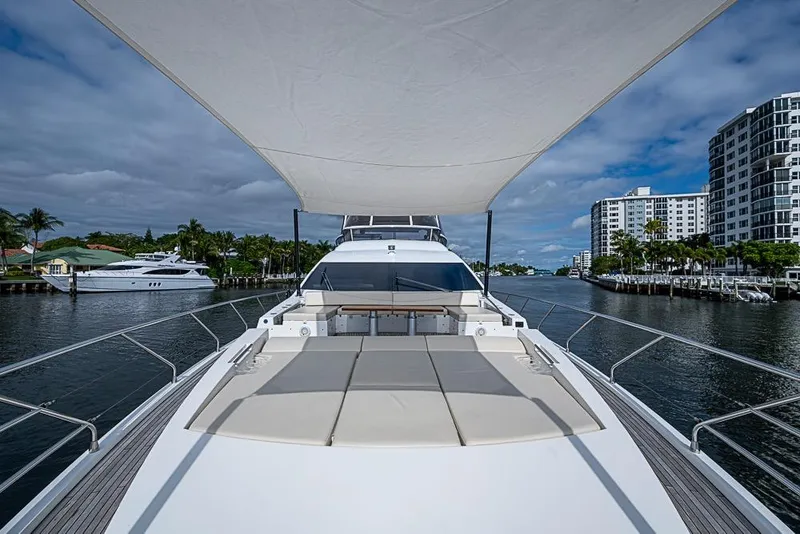 Slide: The Image of Luxurious 2017 Azimut 80 yacht cruising on a scenic waterway with modern buildings. - 8