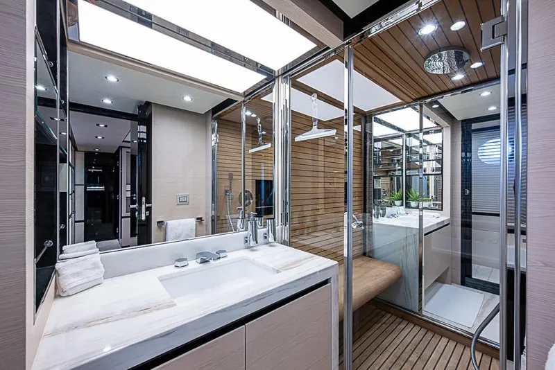 Slide: The Image of Luxurious bathroom interior of 2017 Azimut 80 yacht with modern fixtures and wooden accents. - 80