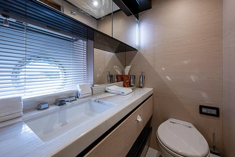 Slide: The Image of Luxurious bathroom in 2017 Azimut 80 yacht with modern fixtures and porthole window. - 86
