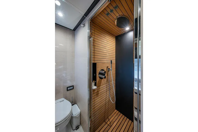 Slide: The Image of Luxurious bathroom in 2017 Azimut 80 yacht with modern shower and wooden accents. - 87