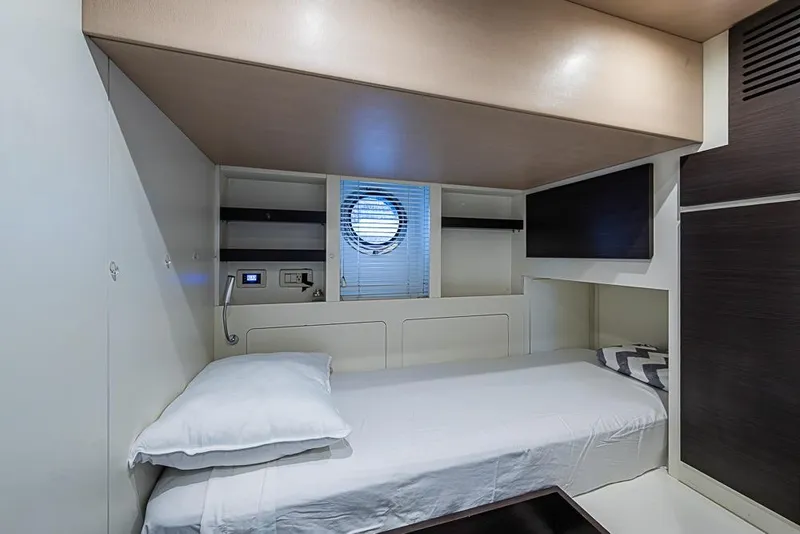 Slide: The Image of 2017 Azimut 80 yacht cabin with single bed, porthole, and modern interior design. - 91