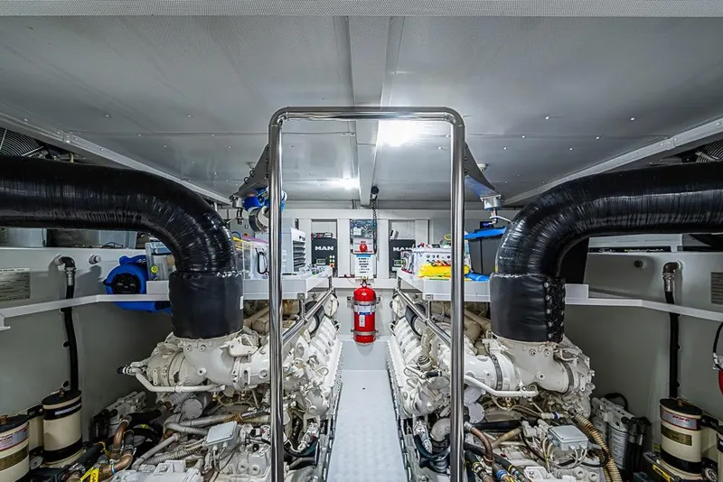 Slide: The Image of Engine room of 2017 Azimut 80 yacht with dual engines and fire extinguisher. - 95