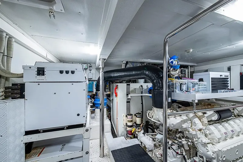 Slide: The Image of Engine room of a 2017 Azimut 80 yacht, showcasing machinery and equipment. - 99