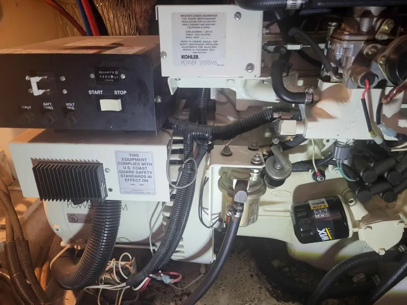 Slide: The Image of Engine room of a 2001 Carver 396 with Kohler Power Systems. - 12