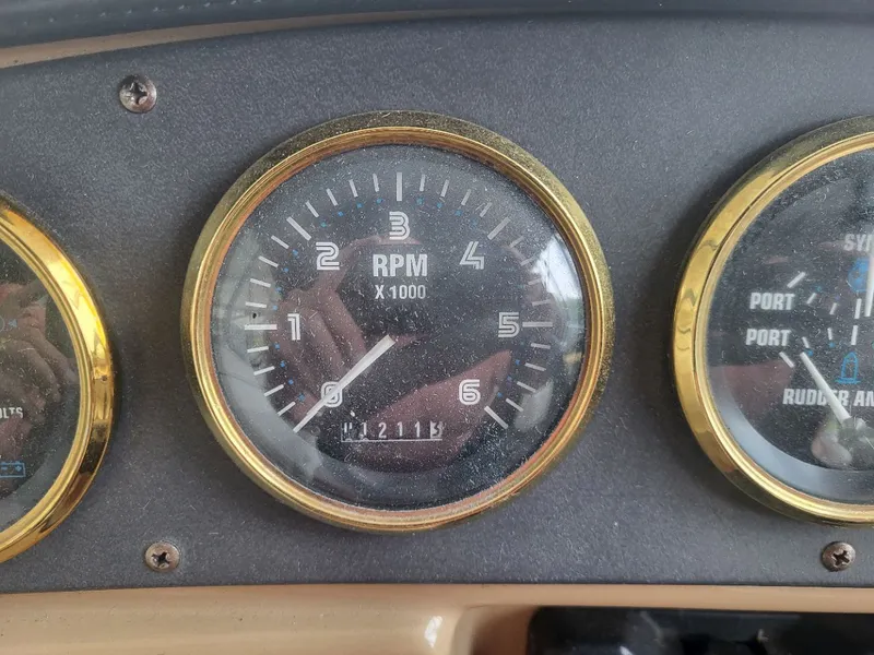 Slide: The Image of 2001 Carver 396 tachometer displaying 1211.5 RPM. - 14