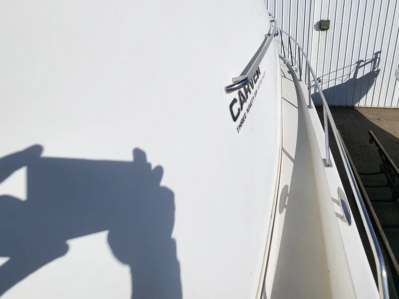 Slide: The Image of Side view of a 2001 Carver 396 yacht. - 18