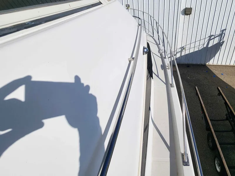 Slide: The Image of Deck view of 2001 Carver 396 yacht with railing. - 19