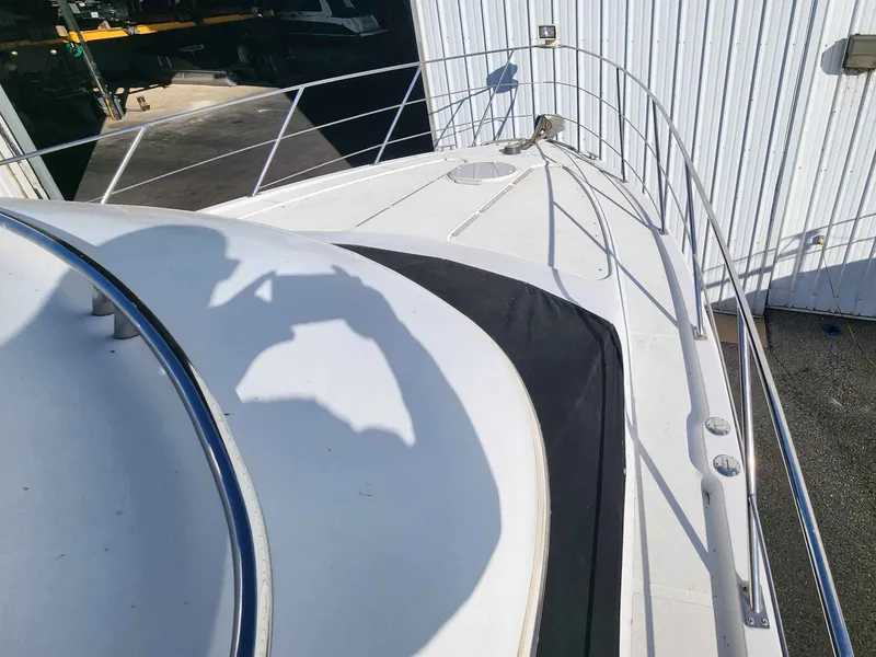 Slide: The Image of Deck of a 2001 Carver 396 boat with photographer's shadow. - 20