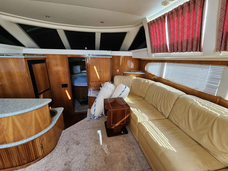 Slide: The Image of Interior of a 2001 Carver 396 yacht with leather sofa. - 33
