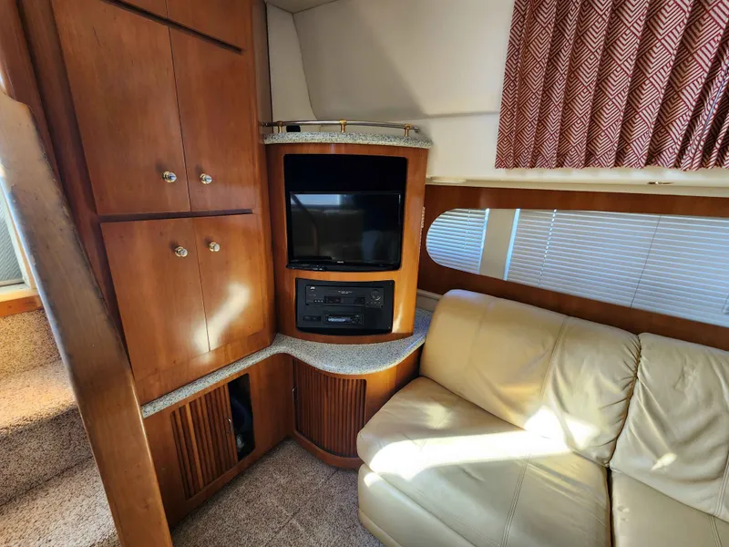 Slide: The Image of Interior of a 2001 Carver 396 yacht with TV and sofa. - 35