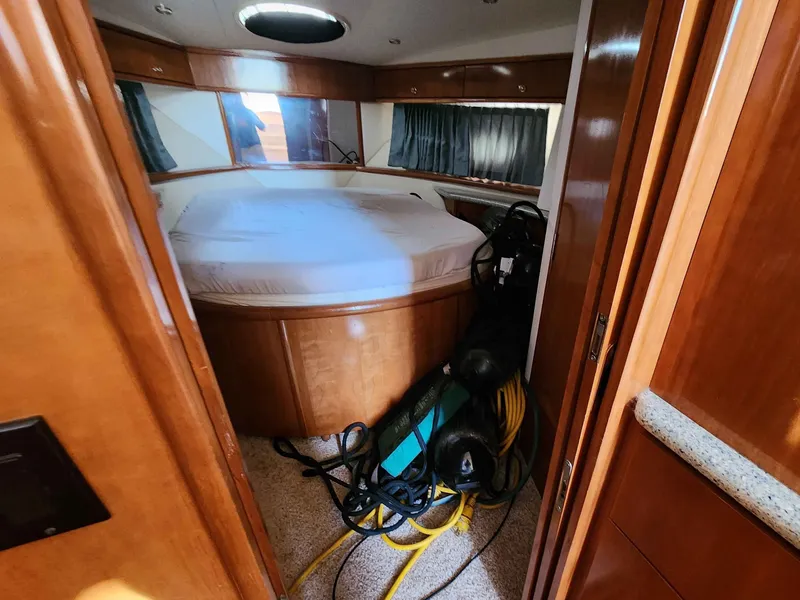 Slide: The Image of Interior of a 2001 Carver 396 yacht with bed and equipment. - 42
