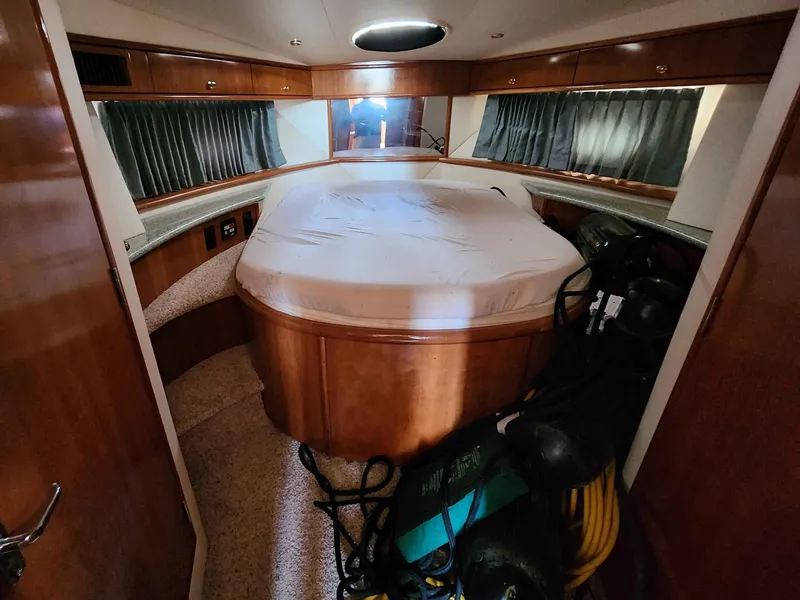Slide: The Image of Interior of a 2001 Carver 396 yacht with bed and storage. - 43