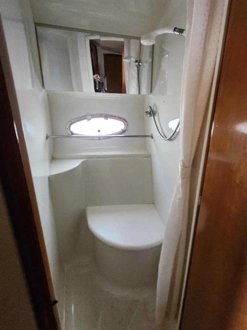 Slide: The Image of Interior of a 2001 Carver 396 yacht with shower and window. - 46