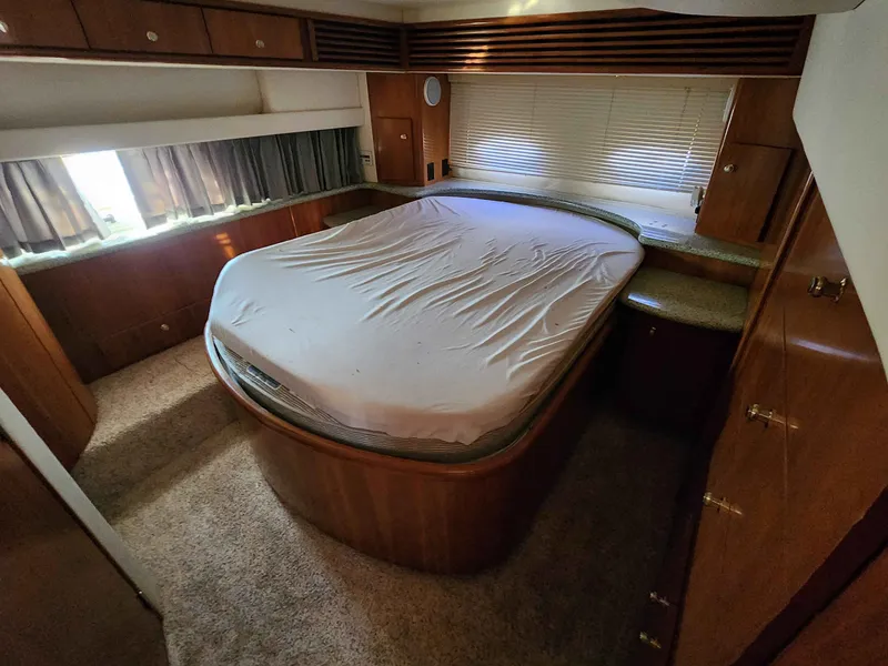 Slide: The Image of Interior of a 2001 Carver 396 yacht with double bed. - 49