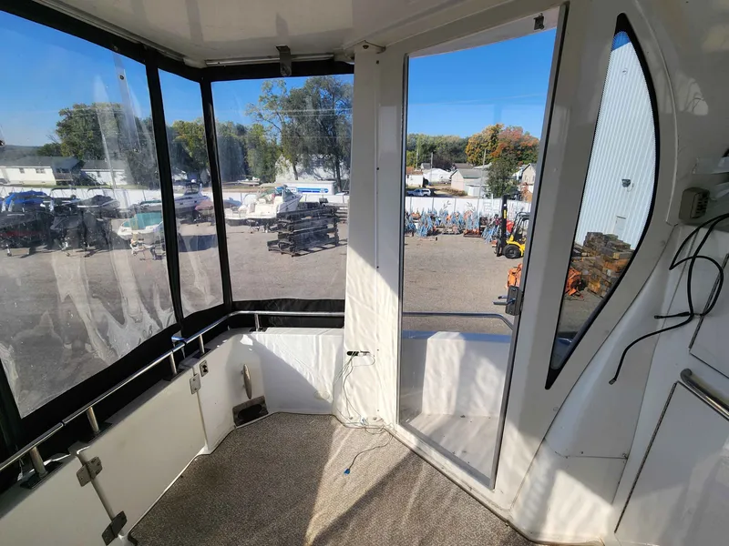 Slide: The Image of Interior of a 2001 Carver 396 yacht with marina view. - 5