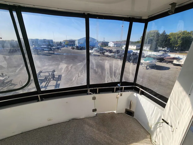 Slide: The Image of Interior view of 2001 Carver 396 yacht with marina view. - 6