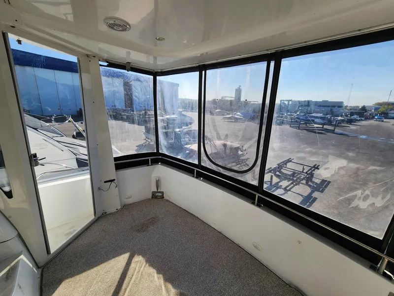 Slide: The Image of Interior of a 2001 Carver 396 yacht with panoramic windows. - 7