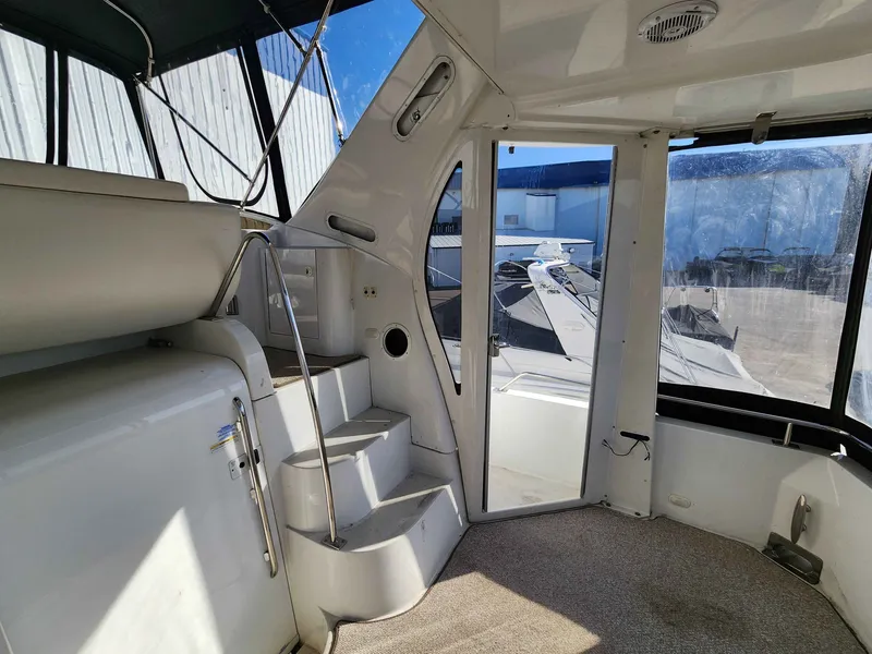 Slide: The Image of Interior of a 2001 Carver 396 yacht with stairs and windows. - 8