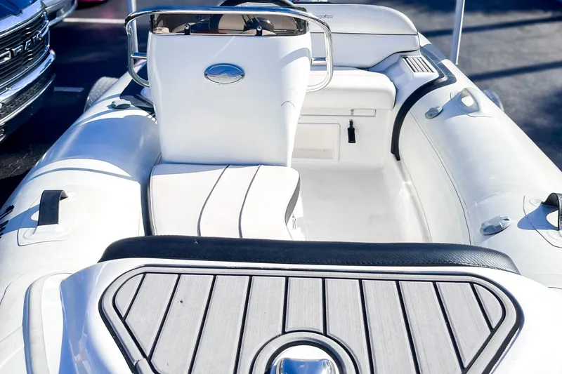 Slide: The Image of 2021 Walker Bay Generation 340 inflatable boat interior with seating and steering console. - 5