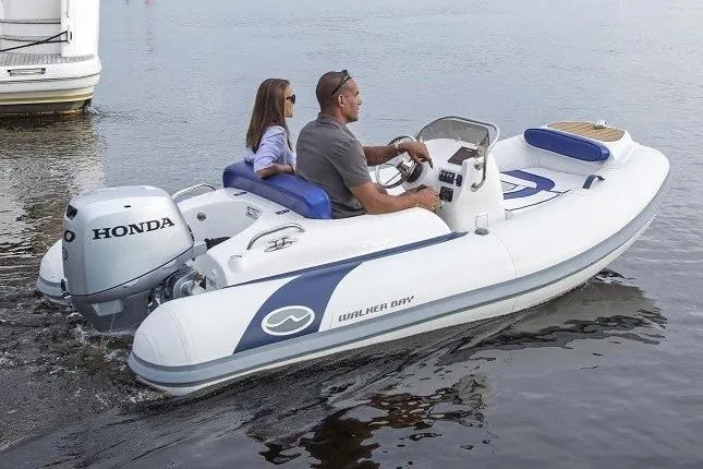 Slide: The Image of Manufacturer Provided Image: 2020 Walker Bay Generation 340 boat with Honda outboard motor on water. - 7