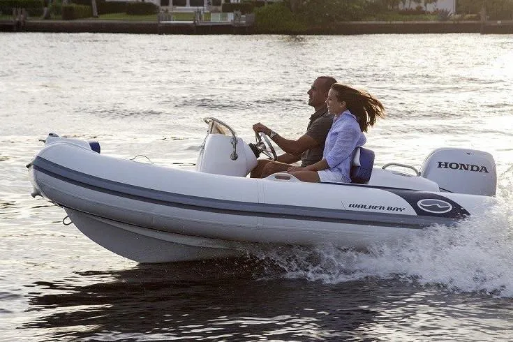 Slide: The Image of Manufacturer Provided Image: 2020 Walker Bay Generation 340 inflatable boat on water with two people. - 8