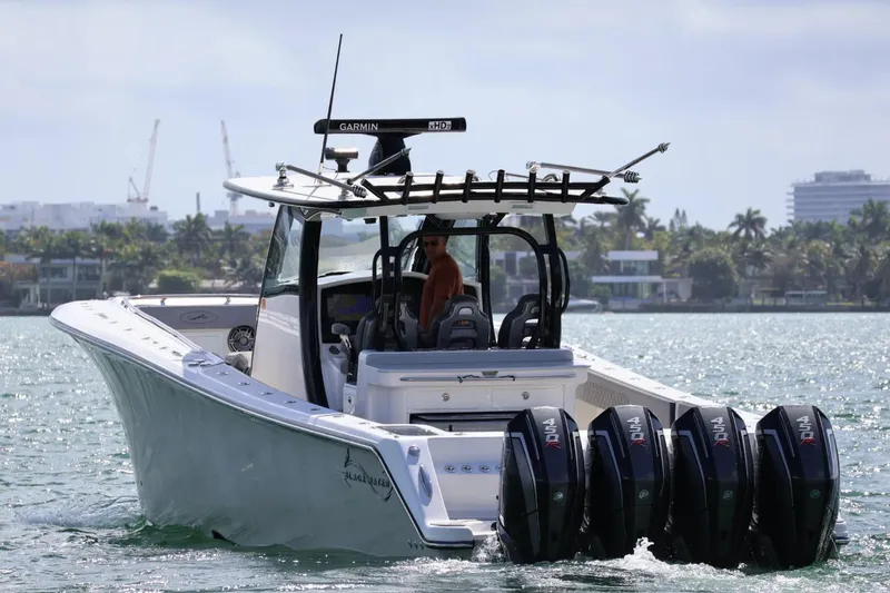 The Image of 2020 Blackwater 41 Performance Fish boat with multiple outboard engines on the water. - 1