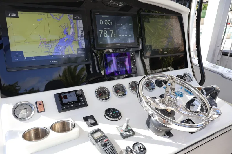 Slide: The Image of 2020 Blackwater 41 Performance Fish dashboard with navigation screens and controls. - 12