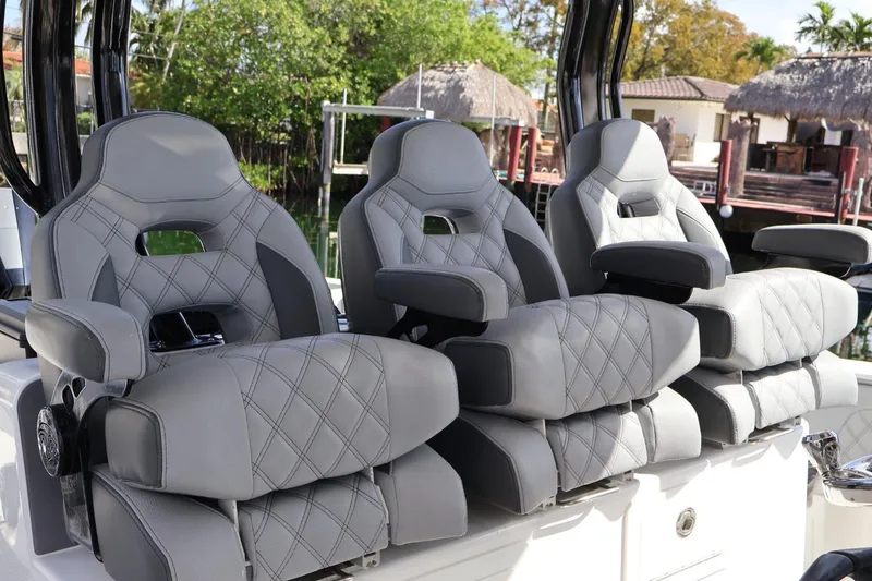 Slide: The Image of Luxury seating on 2020 Blackwater 41 Performance Fish boat, featuring gray diamond-stitched upholstery. - 13