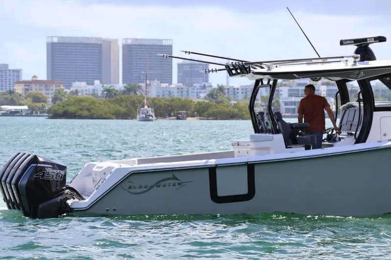 Slide: The Image of 2020 Blackwater 41 Performance Fish boat cruising near city skyline. - 4