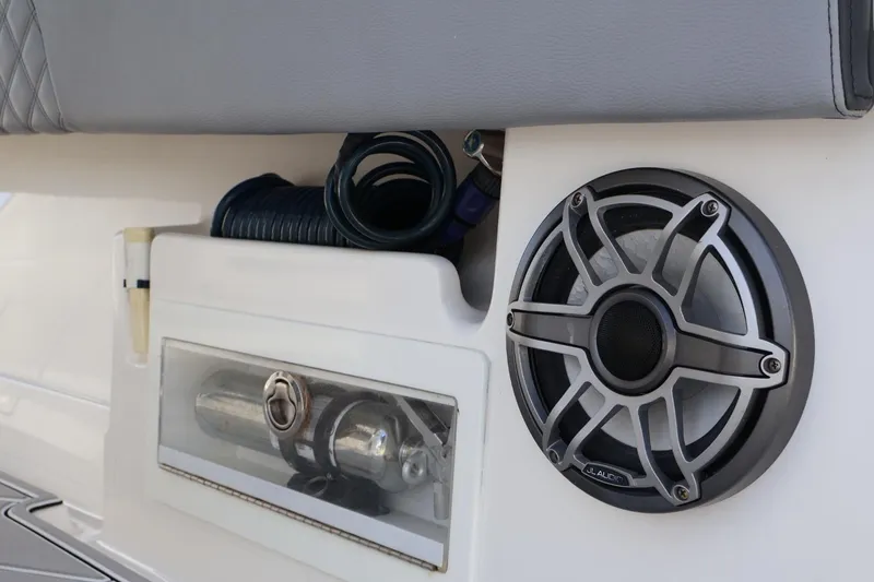 Slide: The Image of 2020 Blackwater 41 Performance Fish boat interior with speaker and storage compartment. - 9