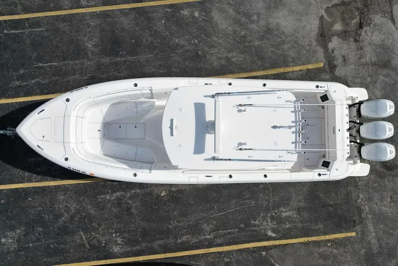 Slide: The Image of Overhead view of 2022 Intrepid 345 Nomad FE boat in parking lot. - 4