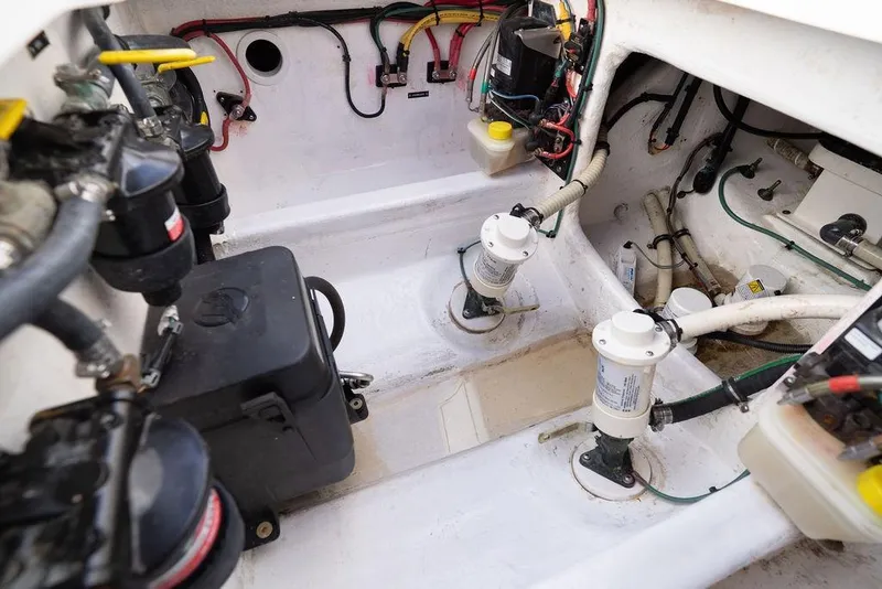 Slide: The Image of Engine compartment of 2022 Intrepid 345 Nomad FE boat, showcasing wiring and components. - 42