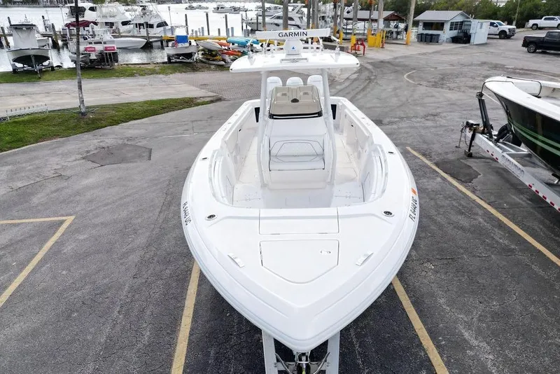 Slide: The Image of 2022 Intrepid 345 Nomad FE boat docked at marina, aerial view. - 6