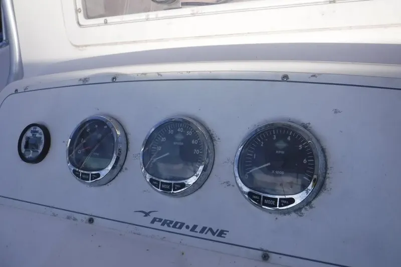 Slide: The Image of Dashboard of 2006 PROLINE 31 Center Console boat with gauges and controls. - 10