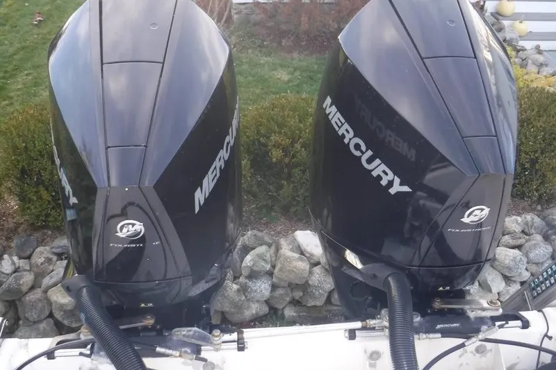 Slide: The Image of Twin Mercury outboard engines on a 2006 PROLINE 31 Center Console boat. - 2