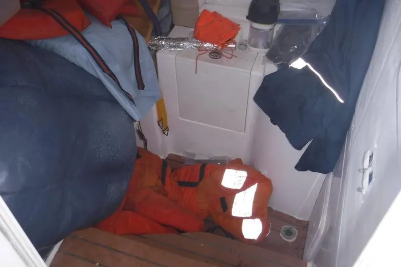 Slide: The Image of Interior of 2006 PROLINE 31 Center Console with life jackets and gear. - 3