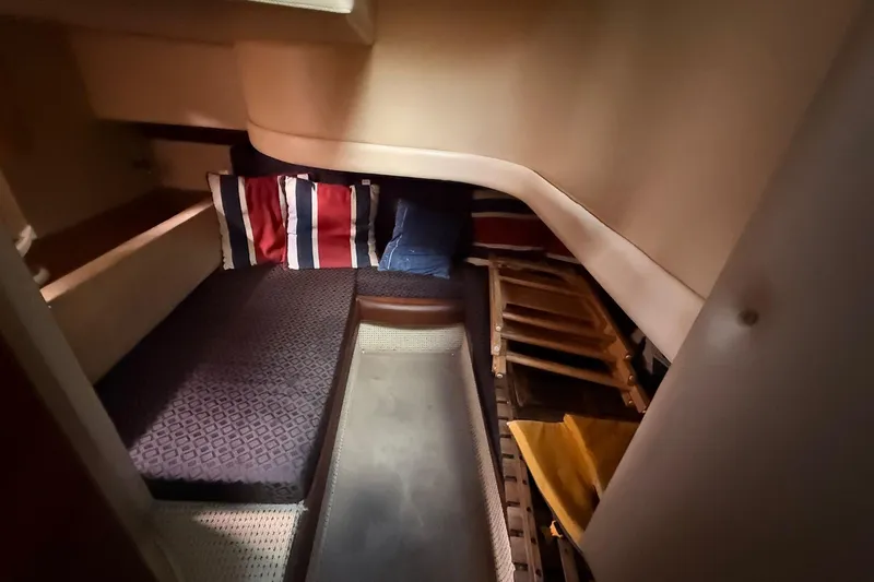 Slide: The Image of Cozy cabin interior of 2008 Meridian 341 Sedan with striped pillows and wooden accents. - 10