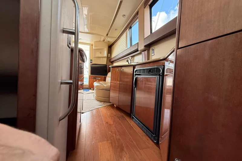Slide: The Image of Interior of 2008 Meridian 341 Sedan yacht with wood flooring and modern amenities. - 11
