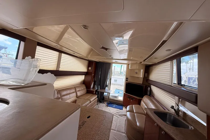 Slide: The Image of Luxurious interior of a 2008 Meridian 341 Sedan yacht with leather seating and modern amenities. - 13