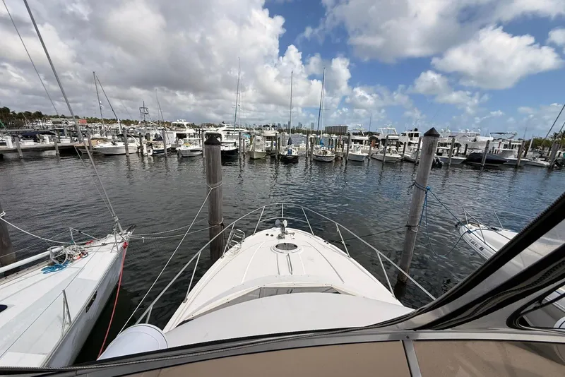Slide: The Image of 2008 Meridian 341 Sedan yacht docked at a marina under a partly cloudy sky. - 17
