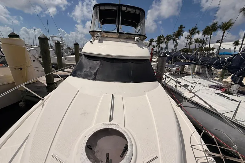 Slide: The Image of 2008 Meridian 341 Sedan yacht docked at marina under blue sky. - 19