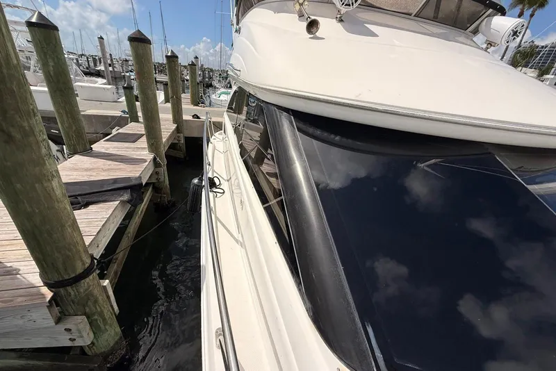 Slide: The Image of 2008 Meridian 341 Sedan yacht docked at marina, clear sky reflection on windows. - 20