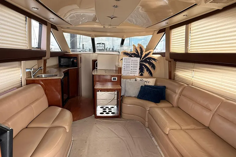 Slide: The Image of Luxurious interior of a 2008 Meridian 341 Sedan yacht with plush seating and kitchenette. - 3