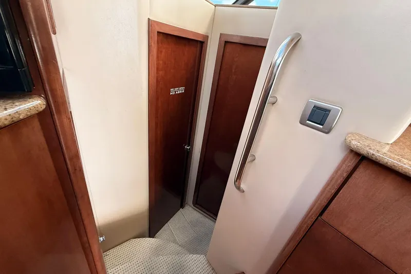 Slide: The Image of Interior view of a 2008 Meridian 341 Sedan yacht with wooden doors and modern fixtures. - 6