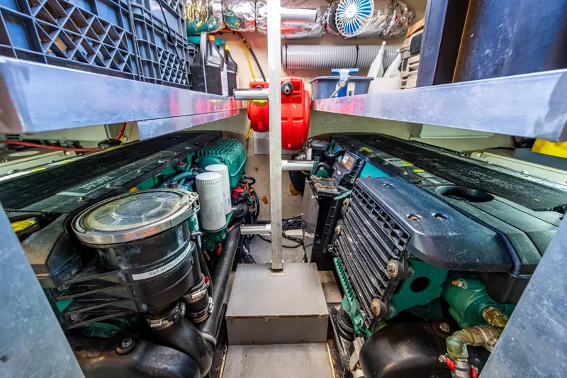 Slide: The Image of Engine room of a 2012 Prestige Flybridge yacht, showcasing dual engines and mechanical components. - 101