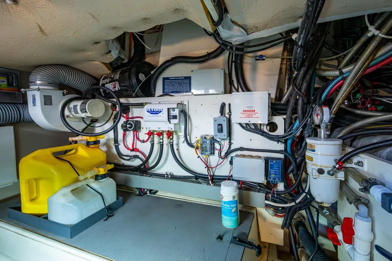 Slide: The Image of Engine room of a 2012 Prestige Flybridge yacht with various mechanical components. - 102