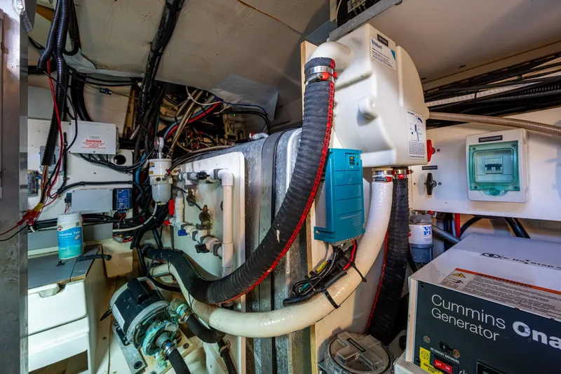 Slide: The Image of Engine room of 2012 Prestige Flybridge yacht with Cummins generator and complex wiring. - 106