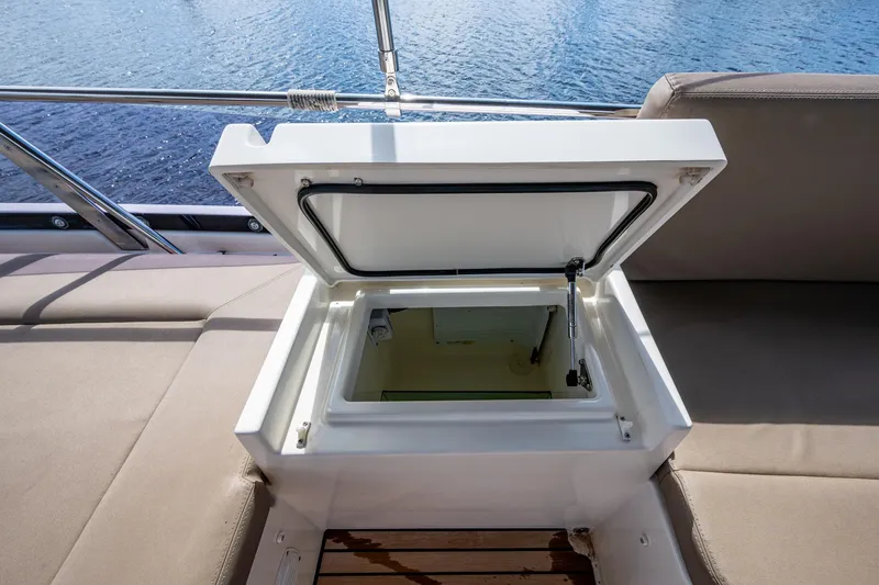 Slide: The Image of Open storage compartment on 2012 Prestige Flybridge yacht, overlooking water. - 30