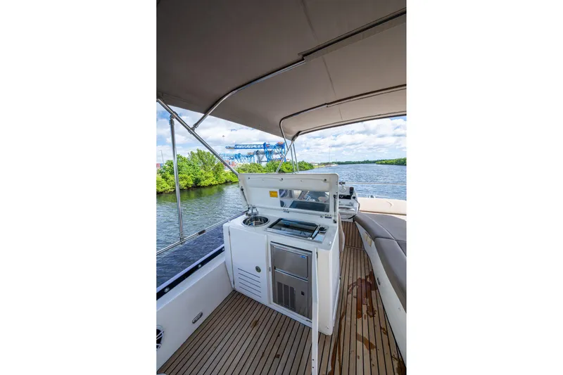 Slide: The Image of 2012 Prestige Flybridge yacht with outdoor kitchen on a scenic river. - 35