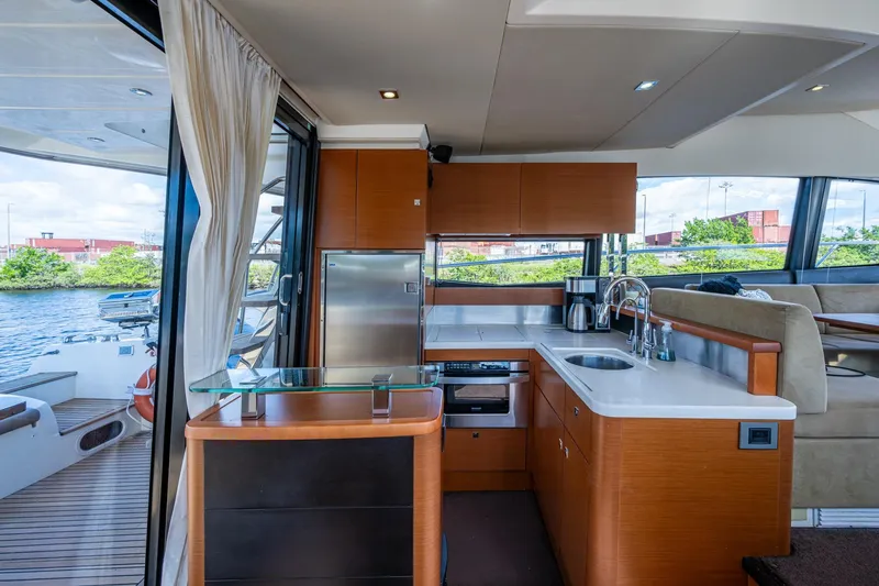 Slide: The Image of Luxurious 2012 Prestige Flybridge yacht interior with modern kitchen and scenic water view. - 44